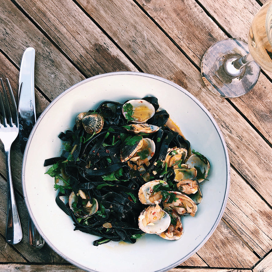 Squid ink fettuccine vongole with nduja
