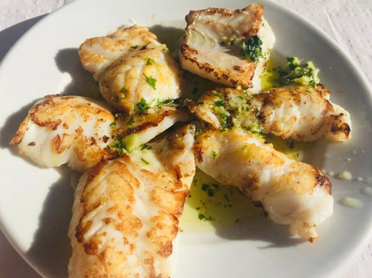 A quick and easy 15-minute recipe to make grilled monkfish fillets topped with a butter lemon garlic sauce